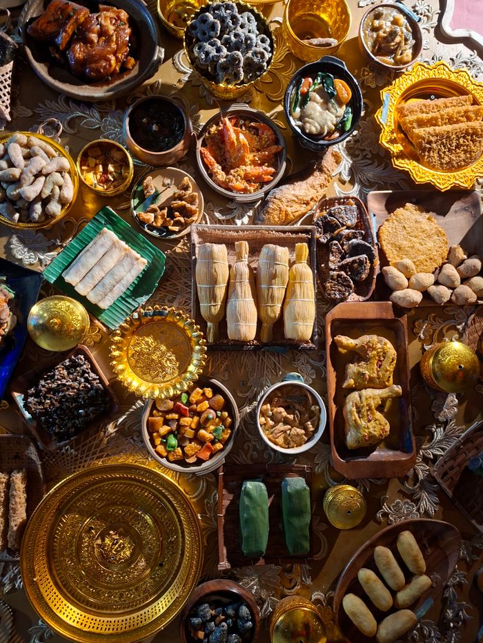 Services A vibrant display of assorted traditional dishes showcasing rich cultural culinary variety.